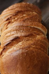 Delicious fresh loaf on a wooden table 