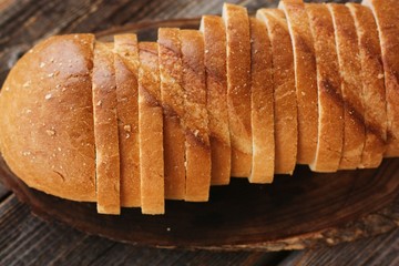 Delicious fresh loaf on a wooden table 
