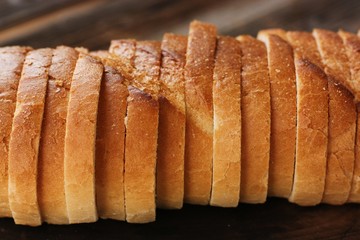 Delicious fresh loaf on a wooden table 