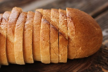 Delicious fresh loaf on a wooden table 