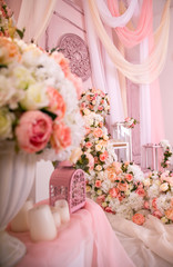 Sofa couch and many flowers abundance pink and white gentle. falls from roses
