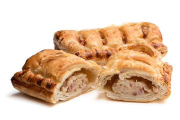 Cheese and bacon sausage rolls isolated on white