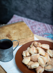 Crispy cottage cheese cookies lies on a brown plate