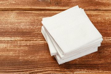 white paper napkin with a textured pattern on an old table