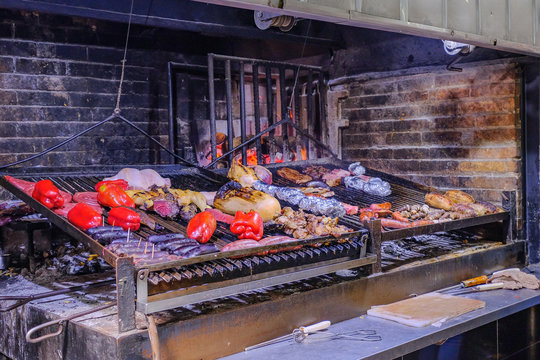 Asado parrillada grill bbq in famous old town Montevideo port market, mercado del puerto, Montevideo, Uruguay
