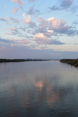 Colorful sky above the broad water of the Danube