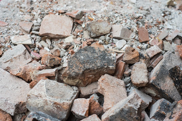 Closeup of broken bricks stack in demolition site