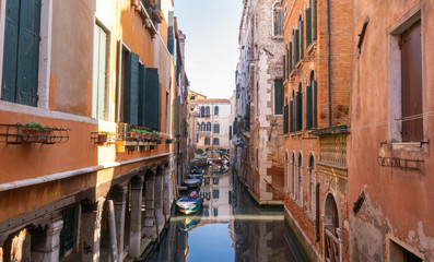 Obraz na płótnie Canvas A typical canal in Venice, Italy