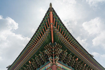 Fototapeta na wymiar Gyeongbokgung Palace roof detail with blue sky in Seoul, South Korea