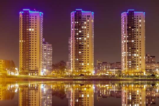 Night city Kiev is reflected in the water.