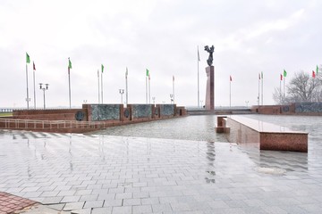Mogilev, Belarus - March 2020. Memorial complex "Fighters for Soviet Power" in Mogilev. Central square with victory obelisk and eternal flame. Town hall. Mogilev landmark, cultural heritage. 