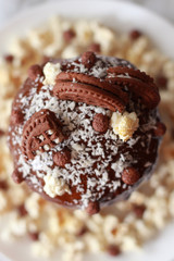 easter chocolate cake with popcorn, coconut and cookies