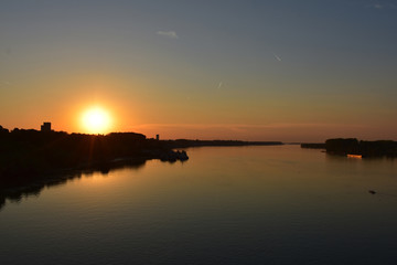 Fototapeta premium Sunset orange over the Danube River. Romantic atmosphere
