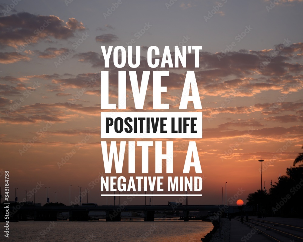 Wall mural motivational quote on sunset background - you can't live a positive life with a negative mind.