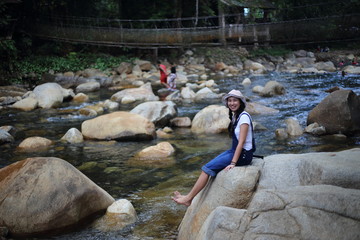 Women playing in fun at Khlong Phaibun Waterfall, Chanthaburi, Thailand