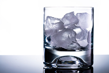 whiskey glass and ice cubes