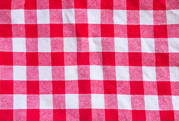 Checkered cloth texture. Red and white squares on textile.