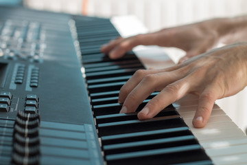 Fototapeta na wymiar hands of a man playing the piano