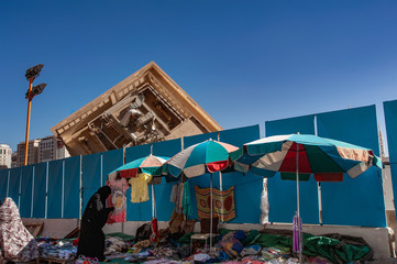 Collapsed Building with street seller as foreground