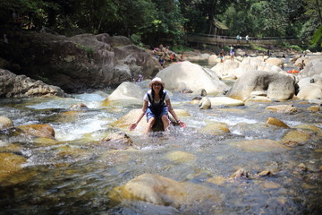 Women playing in fun at Khlong Phaibun Waterfall, Chanthaburi, Thailand