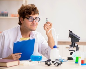 Funny crazy chemist doing experiments and tests