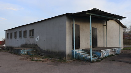 Fototapeta na wymiar typical soviet hangar in rural zone