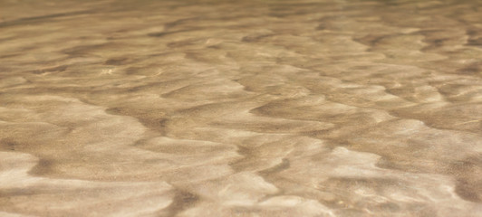Sand texture. Sandy beach for background.  Natural wallpaper or backdrop. 