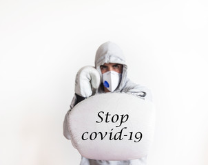 boxer with face mask punching with white glove and stop message covid-19