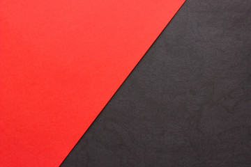 Red and textured black paper background. Abstract banner, poster with place for text. Minimalism