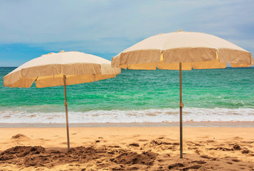 Idyllic beach with white sand and beach umbrellas. Portugal