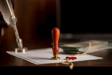 Notary's public pen and stamp on testament and last will. Notary public tools.