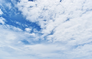 blue sky background with tiny clouds.