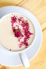 tasty cappuccono with rose petals