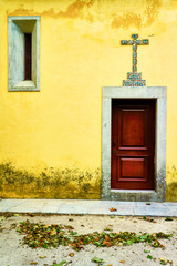 Fototapeta na wymiar Yellow church with red door in Sintra Portugal