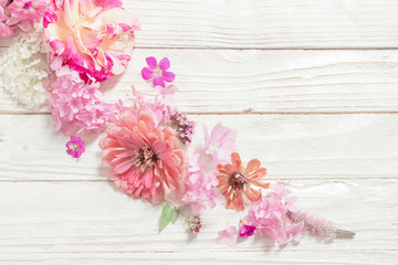 pink flowers on white wooden background