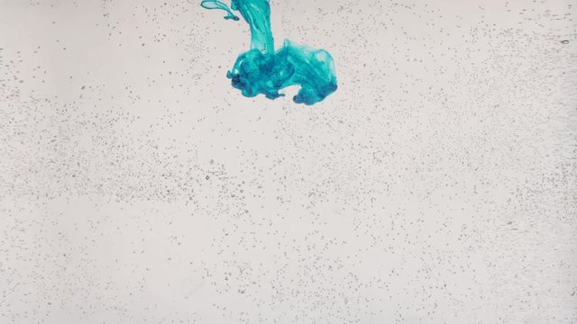 flat bottle and aquamarine watercolours flowing in wate