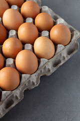 Large flat of brown eggs