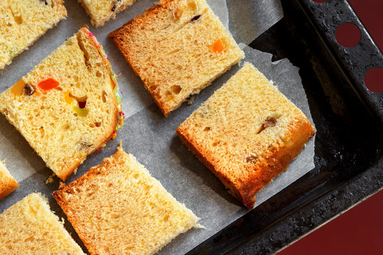 Closeup Photo Of Slices Of Traditional Dried Fruits Cake For Christmas Ready For Baking On The Baking Sheet