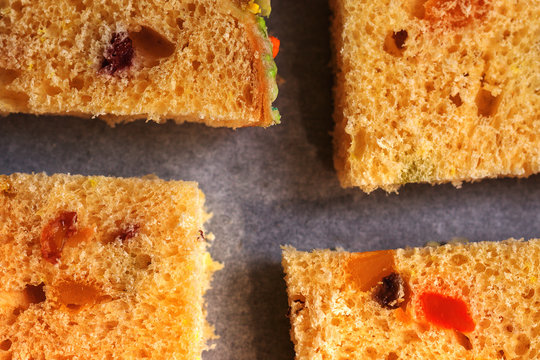 Closeup Photo Of Slices Of Traditional Dried Fruits Cake For Christmas Ready For Baking On The Baking Sheet