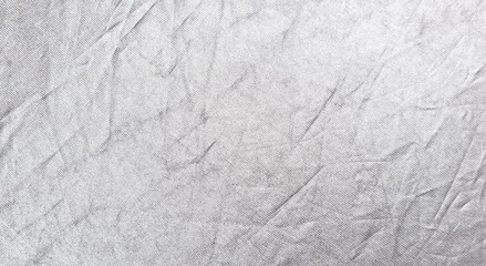 Fototapeta na wymiar Wrinkled white silver fabric. Texture background for design
