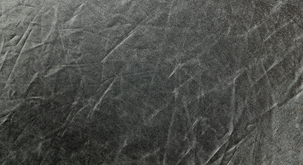 Wrinkled rich black silver fabric. Texture background for design