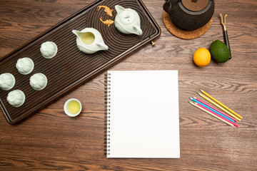 tea and notebook on table