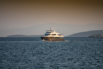 Fototapeta na wymiar leasure boat in the Adriatic Sea on the background of the islands, Croatia.