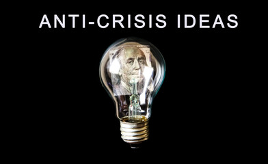 Lamp bulb with a money inside.  Anti-Crisis strategy. Rising on price. New idea concept. No money. Economy crisis, poverty, unemployment concept. Coronavirus, isolation. Inflation rates.