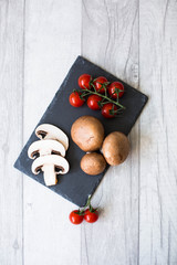 fresh tomatoes on wooden background