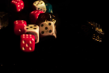 RPG Gaming dices on dark background playing rolling moving movement blur motion handful bunch of dice

