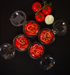 Ripe tomatoes on dark wooden background