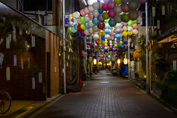 colorful lanterns in a dark street