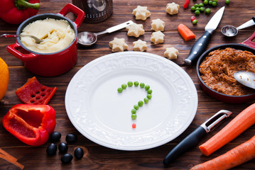 What to cook. Peas on a plate on a dark wooden background