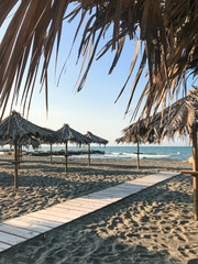 tropical empty beach line without tourists, corona isolation in hotel